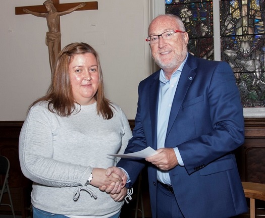 Professor Peter Finn presenting the First Trust Bank Award for Liberal Arts