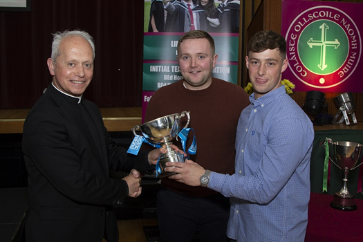 Fr Eugene O’Hagan and students with the Fergal Maher Cup won in February 2018 by the Hurling team