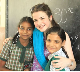 Aoife McGirr of St Mary’s University College with two pupils from Sneha