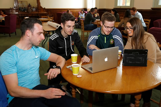 M-Level students enjoying a coffee break between classes.