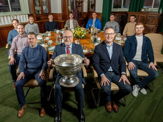 Pictured with the cup are St Mary's Principal, Prof Peter Finn, as well as Gavin McGilly and John Brolly from the College and Tyrone players (clockwise from left) Niall Sludden, Kieran McGeary, Peter Harte, Conor Meyler, Niall Morgan, Conn Kilpatrick, Liam Rafferty, Darragh McAnenly and Cathal McShane.