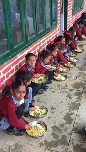 The children of Kalpani High School eating lunch.