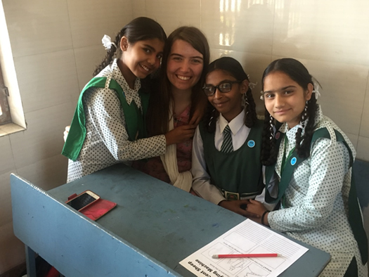 St Mary's student Melissa Robertson with some of the children at Sneha Doon Academy.