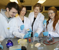 Students and lecturer working in a science lab